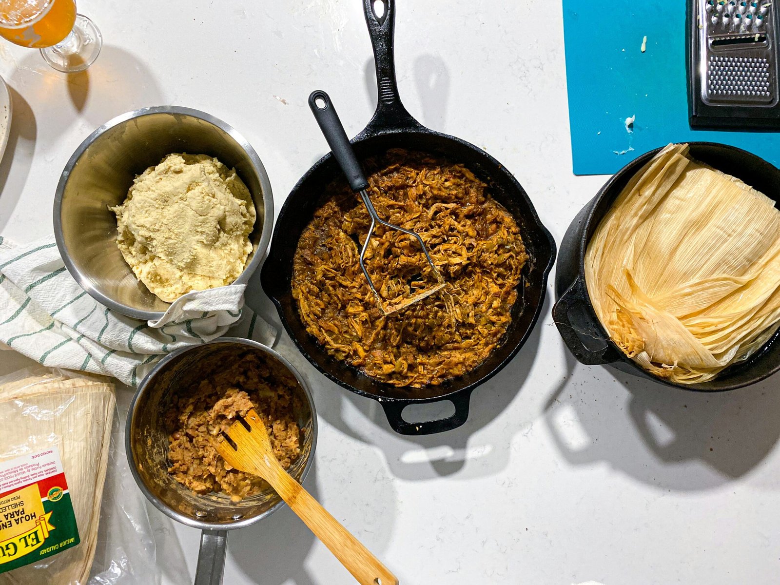 Masa, filling and corn husks laid out for making tamales